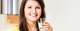 Woman smiling with a drink